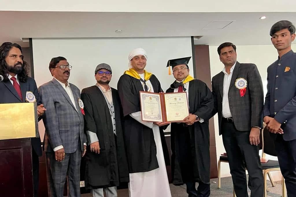 AURION's Managing Director receiving an Honorary Doctorate from Socrates Social Research University