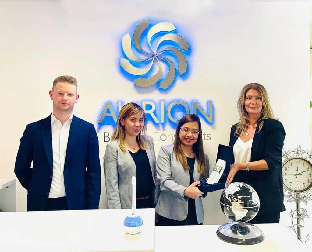 AURION receiving a memento from the IFZA business team
