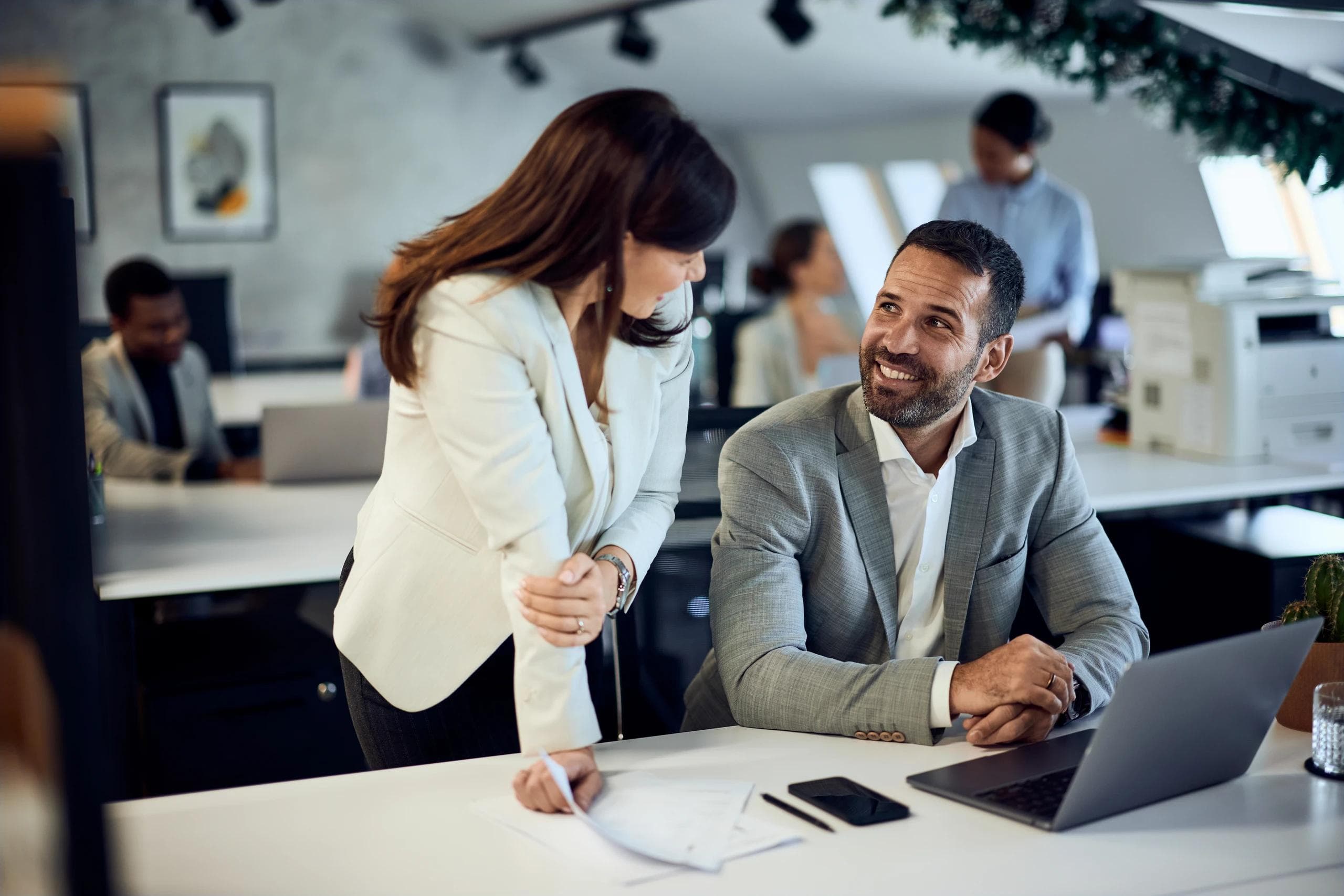 Business professionals in a Dubai office discussing a UAE company setup